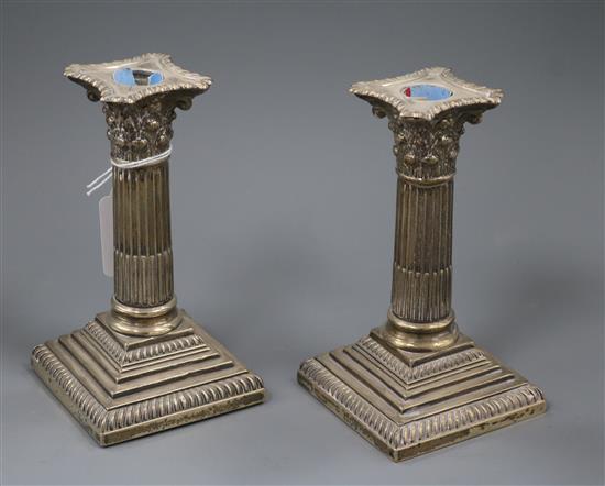 A pair of late Victorian silver dwarf candlesticks, William Hutton & Sons, London, 1895, 15.3cm.